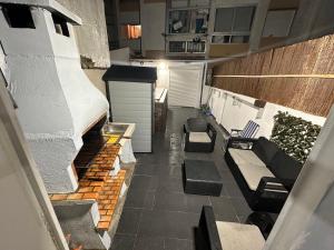 an overhead view of a balcony with couches and chairs at Cacém Maison in Cacém +5 photos