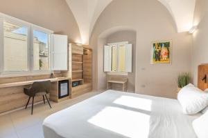 Ένα ή περισσότερα κρεβάτια σε δωμάτιο στο Dimora Del Centro