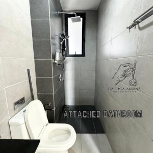 a bathroom with a white toilet and a sink at Urban Suites Studio #SelfCheck-In #PrivateSpace in Jelutong