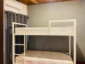 a white bunk bed in a room at Nimneth Villa in Ihalagoda