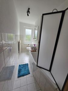 a bathroom with a shower and a sink at Ferienwohnung Wagner in Neustadt