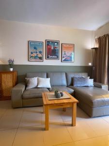 a living room with a couch and a coffee table at Viva Tenerife in Costa Del Silencio