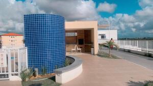a blue building on the side of a building at Residência da day in Aracaju