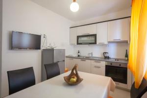 Kuchyň nebo kuchyňský kout v ubytování Apartments Gaston