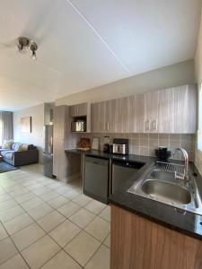 a kitchen with a sink and a counter top at Yanaz Place in Germiston