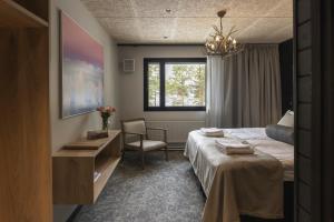 Postel nebo postele na pokoji v ubytování Kelo Resort - northern lights and wilderness adventures in Kittilä