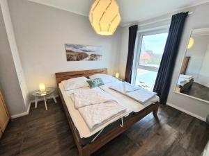 Ένα ή περισσότερα κρεβάτια σε δωμάτιο στο Ferienwohnung Fiete P.