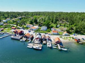 an aerial view of a marina with boats in the water at Charming Cottage Near The Sea On Rossö in Nyckleby