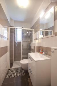 Kuchyň nebo kuchyňský kout v ubytování Apartments Gaston