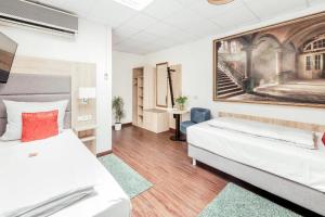 Postel nebo postele na pokoji v ubytování Pallas Hotels