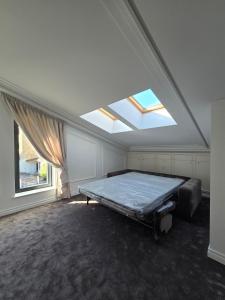 a bedroom with a bed and a window at Vilnius Central House in Vilnius