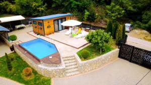 an aerial view of a house with a swimming pool at Vikendica Blagojević Čačak in Čačak