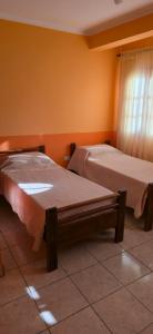 Ένα ή περισσότερα κρεβάτια σε δωμάτιο στο Tierra del Sol