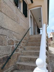 a set of stairs leading up to a house at Casa D'avó in Sabrosa