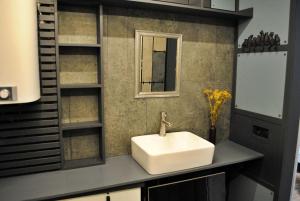 a bathroom with a white sink and a mirror at SpitzBergen house in Oryavchyk +42 photos