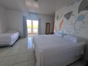 Postel nebo postele na pokoji v ubytování Casa para temporada c/ ar condicionado, próximo da praia e do Beco das Garrafas