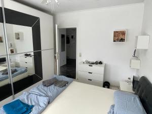 a bedroom with a bed and a large mirror at Casa Pelzerro in Aachen
