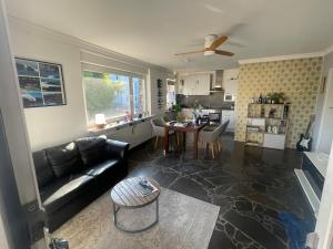 a living room with a couch and a table at Casa Pelzerro in Aachen