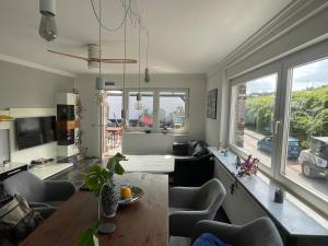 a living room with a couch and a table at Casa Pelzerro in Aachen