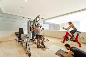 a group of people riding bikes in a gym at Oriva Nestlay Rooms Ramnad - Nr Golden Shopping Mall in Rāmanāthapuram