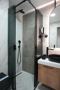 a bathroom with a shower and a sink at Madera apartments in Čačak +112 photos