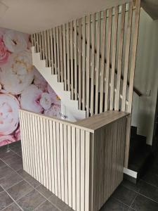 a wooden stair case with aroll at Hippo Zwartkop Suites in Centurion