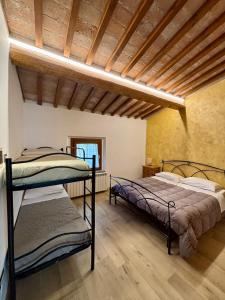 Postel nebo postele na pokoji v ubytování Agriturismo la Tana