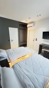 Ένα ή περισσότερα κρεβάτια σε δωμάτιο στο VV Luxe