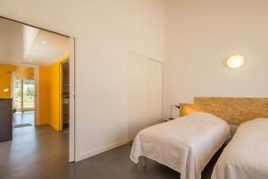 Ένα ή περισσότερα κρεβάτια σε δωμάτιο στο Gîte de la Gare 2