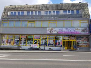 a building with lots of signs on the side of it at Bobowianka in Bobowa