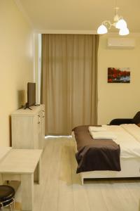 Postel nebo postele na pokoji v ubytování Sea&city Batumi