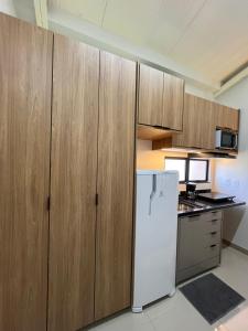 Η κουζίνα ή μικρή κουζίνα στο Apartamento Loft 5 - próximo ao shopping