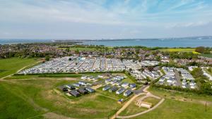 an aerial view of a large parking lot with cars at Hayling Island Holiday Park in South Hayling +19 photos