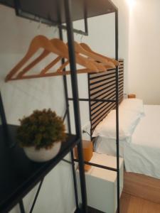 a room with a bunk bed and a shelf with a plant at GO&REST Apartments in Valencia