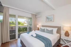Ένα ή περισσότερα κρεβάτια σε δωμάτιο στο Little Cove Getaway Noosa 2BR