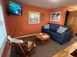 a living room with a couch and a table at Lakin' It Easy in Middlebury