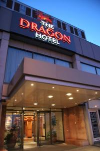 a hotel with a sign that reads the dragon hotel at The Dragon Hotel in Swansea