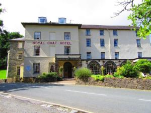 a large white building with the royal coast court hotel at Royal Goat Hotel in Beddgelert