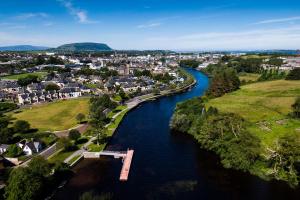 an aerial view of a river in a town at The Lofty Escape in Sligo +8 photos