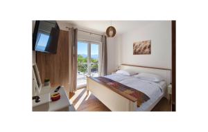Ένα ή περισσότερα κρεβάτια σε δωμάτιο στο Lovely Home In Sinj