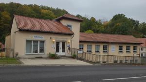 a building on the side of a road with a street at Burgblick in Nossen