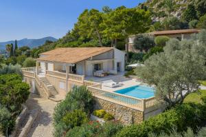 an aerial view of a house with a swimming pool at Villa Bonjour in El Port