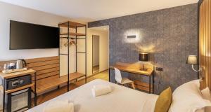 Ένα ή περισσότερα κρεβάτια σε δωμάτιο στο Best Western Côte des Sables Plouescat