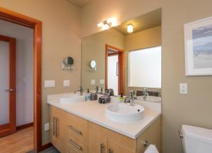 a bathroom with two sinks and a large mirror at ALOFT in Hood River +16 photos