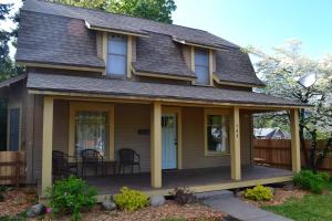 a house with a porch with a table and chairs at Lucky 30 Day in Hood River