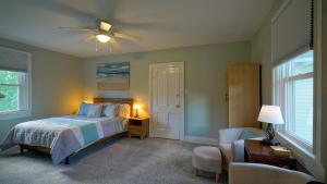 a bedroom with a bed and a ceiling fan at The Still Pond Inn in Still Pond