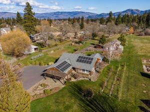 an aerial view of a house with solar panels on it at Quail On Sunset in Hood River