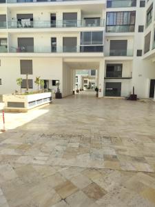an empty courtyard of an apartment building at Hajmbark in Agadir +10 photos