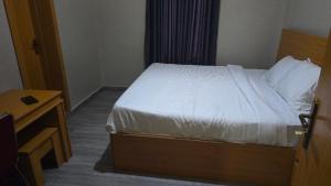 Postel nebo postele na pokoji v ubytování Camas Inn Opako Abeokuta