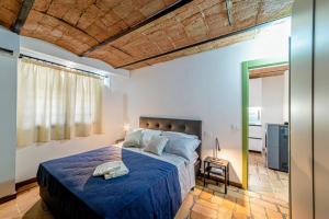 Ένα ή περισσότερα κρεβάτια σε δωμάτιο στο Podere Fonte Luxury Country House +25 φωτογραφίες